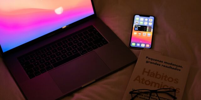 macbook pro on brown textile